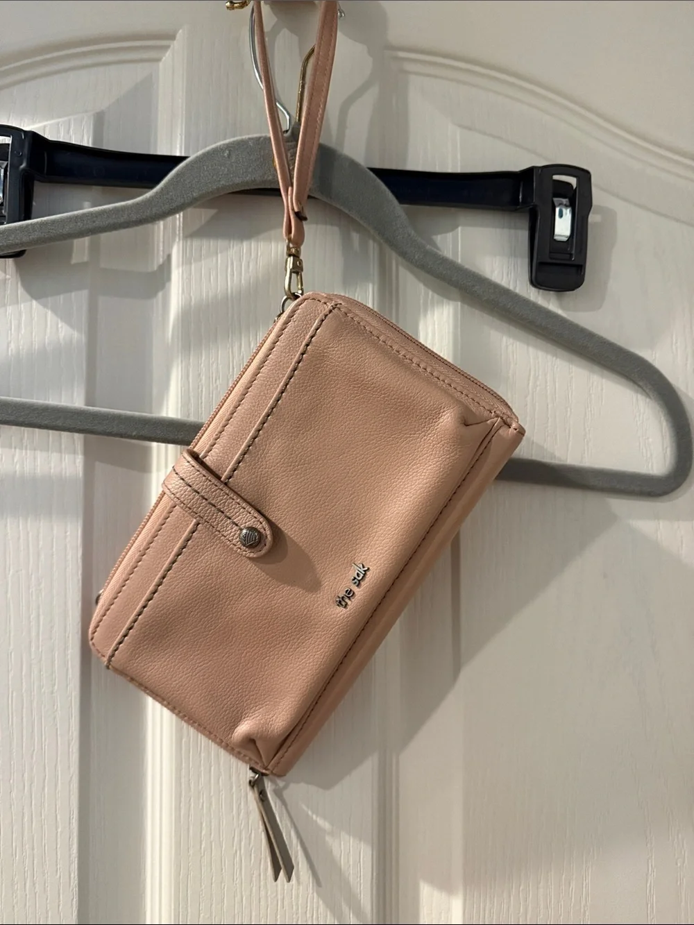 The Sak Pebbled Wristlet Phone Case in Blush Pink